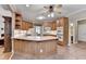 Spacious kitchen showcasing wood cabinets, tile floors, and stainless steel double ovens at 1640 Mount Mckinley Dr, Grayson, GA 30017