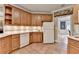 Kitchen with wooden cabinets, under cabinet lighting, and tile floors at 1640 Mount Mckinley Dr, Grayson, GA 30017