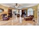 Open living room featuring hardwood floors, fireplace, and seamless flow to the dining area at 1640 Mount Mckinley Dr, Grayson, GA 30017