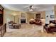 Inviting living room featuring a fireplace, hardwood floors, and comfortable seating arrangement at 1640 Mount Mckinley Dr, Grayson, GA 30017