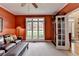 Spacious living room with leather furniture, large window, and beautiful doorway at 1640 Mount Mckinley Dr, Grayson, GA 30017