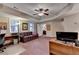 Comfortable home office features recessed lighting, carpeting, and a relaxing plaid sofa at 1640 Mount Mckinley Dr, Grayson, GA 30017