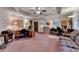 Spacious home office with neutral walls, carpeting, multiple work stations, and great natural light at 1640 Mount Mckinley Dr, Grayson, GA 30017