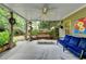 Covered patio with seating, a decorative swing, and a view of the backyard at 1640 Mount Mckinley Dr, Grayson, GA 30017