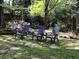 Outdoor stone patio featuring inviting Adirondack chairs, perfect for relaxing in the garden at 1640 Mount Mckinley Dr, Grayson, GA 30017