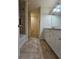 Bathroom featuring a double sink vanity, tile floors, and tub shower combo at 2131 Meadow Peak Rd, Duluth, GA 30097