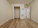 Bright bedroom with wood look floors, a closet with wire shelving, and a mirror for added convenience at 2131 Meadow Peak Rd, Duluth, GA 30097