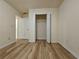 Light-filled bedroom offering wood look floors, a closet with wire shelving and a neutral paint scheme at 2131 Meadow Peak Rd, Duluth, GA 30097
