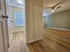A bedroom featuring wood floors, a ceiling fan, and neutral-colored walls at 2131 Meadow Peak Rd, Duluth, GA 30097