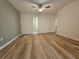 Spacious bedroom featuring wood floors, neutral walls, and a ceiling fan at 2131 Meadow Peak Rd, Duluth, GA 30097