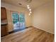 Dining area featuring wood floors and sliding glass doors leading to the back patio at 2131 Meadow Peak Rd, Duluth, GA 30097