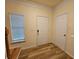 Entryway with a secure lock set, stairs, and sleek wood-look flooring at 2131 Meadow Peak Rd, Duluth, GA 30097