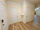 Entryway featuring neutral paint, sleek flooring, and access to coat closet at 2131 Meadow Peak Rd, Duluth, GA 30097