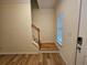 Foyer features a staircase, window, and secure door lock, set on sleek floors at 2131 Meadow Peak Rd, Duluth, GA 30097