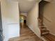 Inviting entry hallway showcasing wood floors and stairs leading to the upper level at 2131 Meadow Peak Rd, Duluth, GA 30097