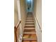 Carpeted staircase with wooden banister, leading to upper level at 2131 Meadow Peak Rd, Duluth, GA 30097