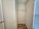 Walk-in closet features clothing rack, window with blinds, and vinyl floors at 2131 Meadow Peak Rd, Duluth, GA 30097