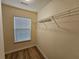 A walk-in closet featuring a clothing rack and a window with blinds at 2131 Meadow Peak Rd, Duluth, GA 30097
