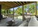 Covered back deck featuring wood floors, wood railings, and view of backyard at 2608 Argo Drive Southeast Se Dr, Smyrna, GA 30080