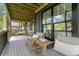 A covered back porch with wood beams and relaxing outdoor seating area at 2608 Argo Drive Southeast Se Dr, Smyrna, GA 30080
