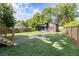 Backyard view with grassy yard, and modern outbuilding with walkway and fire pit at 2608 Argo Drive Southeast Se Dr, Smyrna, GA 30080