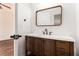 Well-appointed bathroom featuring a rustic vanity with drawers and a rectangle mirror at 2608 Argo Drive Southeast Se Dr, Smyrna, GA 30080