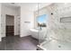 Luxurious bathroom featuring a standalone tub, a walk-in shower with marble tiling, and modern fixtures at 2608 Argo Drive Southeast Se Dr, Smyrna, GA 30080