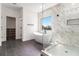 Modern bathroom with a soaking tub, glass-enclosed shower, and elegant tile work at 2608 Argo Drive Southeast Se Dr, Smyrna, GA 30080