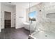 Stunning bathroom with walk in shower and a luxurious soaking tub by a window at 2608 Argo Drive Southeast Se Dr, Smyrna, GA 30080