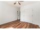 Sunny bedroom features hardwood floors, a ceiling fan, and a double-door closet at 2608 Argo Drive Southeast Se Dr, Smyrna, GA 30080