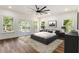 Modern bedroom features a large bed, stylish furnishings, and sliding glass doors with access to a deck at 2608 Argo Drive Southeast Se Dr, Smyrna, GA 30080