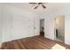 Bright bedroom with wood floors, a ceiling fan, closet and access to other rooms at 2608 Argo Drive Southeast Se Dr, Smyrna, GA 30080