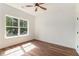 Bedroom with large window offering bright, natural light and hardwood floors at 2608 Argo Drive Southeast Se Dr, Smyrna, GA 30080