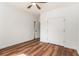 Bedroom with wood floors, a ceiling fan, and double doors that provide access to the closet at 2608 Argo Drive Southeast Se Dr, Smyrna, GA 30080