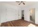 Bright bedroom with hardwood floors, a ceiling fan, and a double door closet at 2608 Argo Drive Southeast Se Dr, Smyrna, GA 30080
