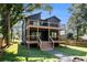 Stylish two-story home with multiple decks, lush green lawn, and mature shade trees at 2608 Argo Drive Southeast Se Dr, Smyrna, GA 30080