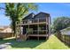 Beautiful two-story home featuring multiple decks, a modern exterior, and grassy yard at 2608 Argo Drive Southeast Se Dr, Smyrna, GA 30080