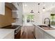 Modern kitchen with white cabinets, stainless steel appliances, and center island at 2608 Argo Drive Southeast Se Dr, Smyrna, GA 30080