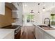 Modern kitchen with stainless steel appliances, quartz countertops, and stylish backsplash at 2608 Argo Drive Southeast Se Dr, Smyrna, GA 30080