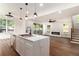 Open-concept kitchen featuring white cabinets, quartz counters, and stainless steel appliances at 2608 Argo Drive Southeast Se Dr, Smyrna, GA 30080