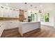 Modern kitchen with white cabinets, quartz countertops, a large island, and stainless steel appliances at 2608 Argo Drive Southeast Se Dr, Smyrna, GA 30080