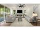 Inviting living room with a fireplace, neutral furniture, and a sliding door access to the deck at 2608 Argo Drive Southeast Se Dr, Smyrna, GA 30080