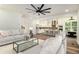 Open-concept living room featuring modern decor, neutral colors and hardwood flooring at 2608 Argo Drive Southeast Se Dr, Smyrna, GA 30080