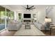 Stylishly decorated living room featuring modern furniture, a fireplace, and views of the outdoor deck at 2608 Argo Drive Southeast Se Dr, Smyrna, GA 30080