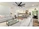 Stylishly furnished living room, showcasing an open floor plan with views of the modern kitchen and dining area at 2608 Argo Drive Southeast Se Dr, Smyrna, GA 30080