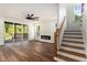 Bright living room with wood floors, fireplace, and staircase to the second floor at 2608 Argo Drive Southeast Se Dr, Smyrna, GA 30080