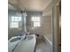 Bathroom featuring a double sink vanity, tile flooring, and a combined shower and tub at 3415 Spring Valley Blvd, Atlanta, GA 30349