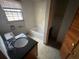 Bathroom features a sink, toilet, and a bathtub at 3415 Spring Valley Blvd, Atlanta, GA 30349