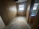 Bedroom with wood paneling and a window at 3415 Spring Valley Blvd, Atlanta, GA 30349