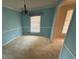 Bright dining room with neutral colored carpet and plenty of natural light at 3415 Spring Valley Blvd, Atlanta, GA 30349